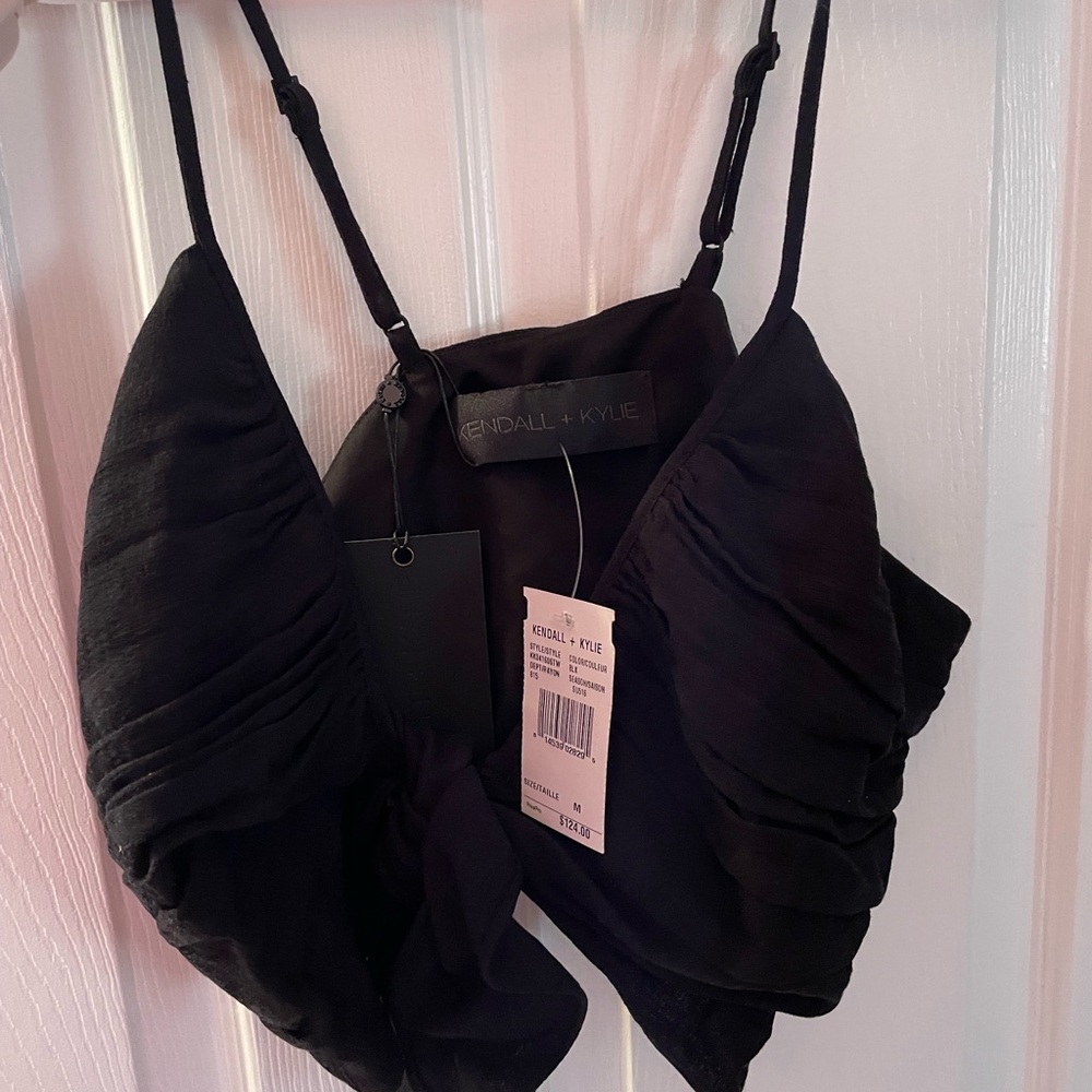 Never been worn black bra top that ties in the front